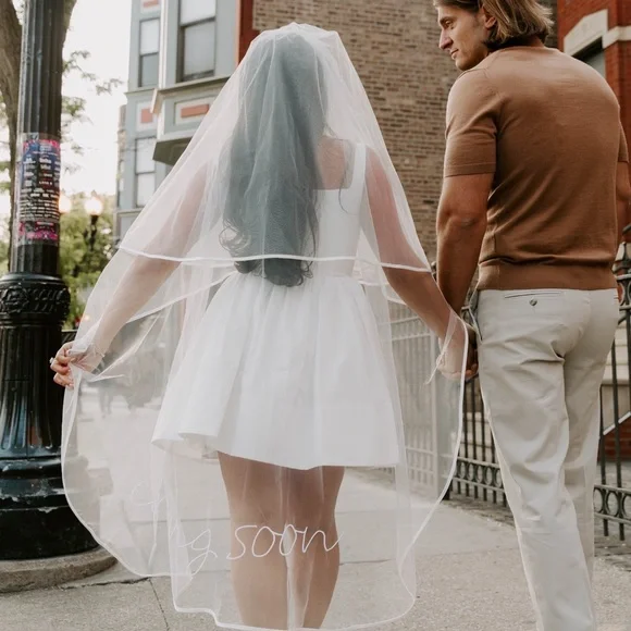 Staud White Bridal Veil with 'Coming Soon' Text